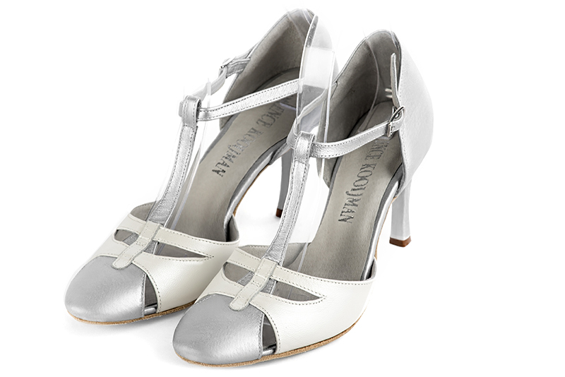 Light silver and pure white women's T-strap open side shoes. Round toe. High slim heel. Front view - Florence KOOIJMAN